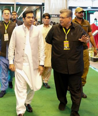 Guests touring the auto show floor